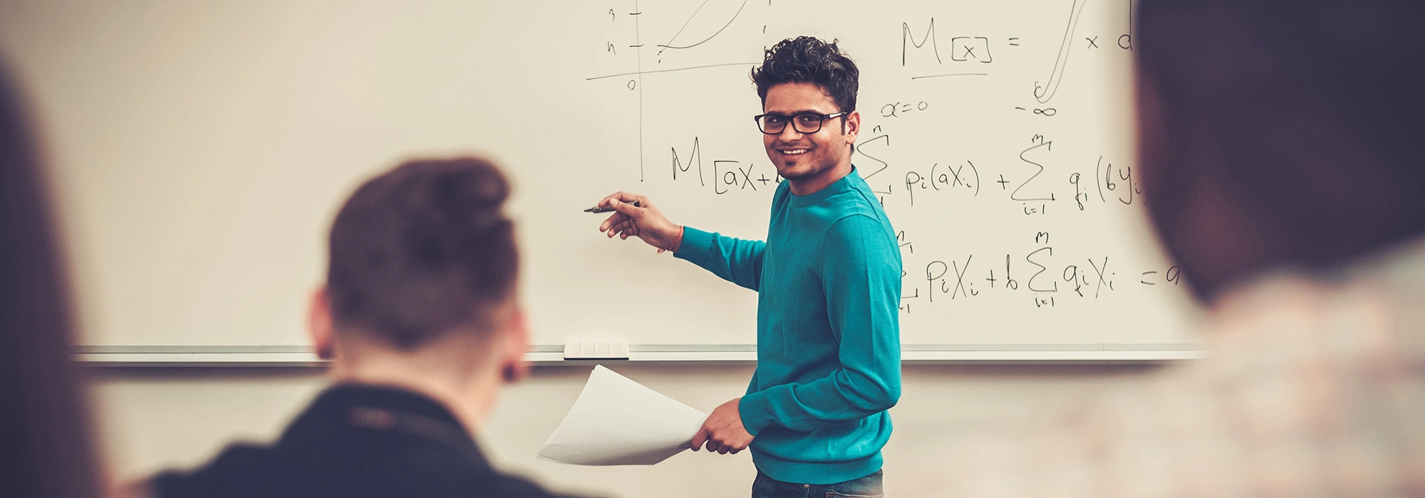 Man teaching on a whiteboard